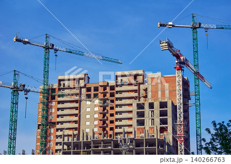 Large high rise crane, new building.Construction site. Large high rise crane, new building.Construction site. 140266763