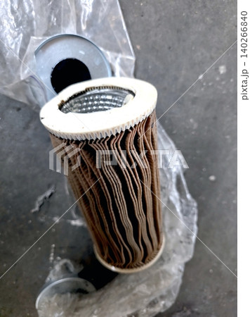 Worn Hydraulic Oil Filter Found During Maintenance in a Workshop Worn Hydraulic Oil Filter Found During Maintenance in a Workshop 140266840