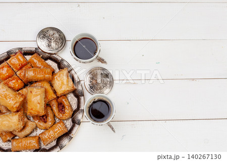 Cup of hot tea and a plate of turkish desserts Cup of hot tea and a plate of turkish desserts 140267130