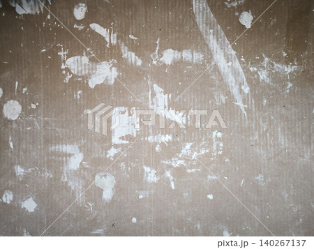 Rough brown wall with white plaster stains 140267137