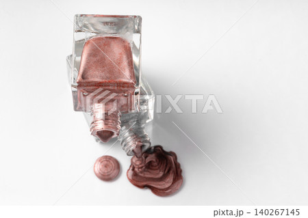 Close up of a nail polish puddle over white background 140267145