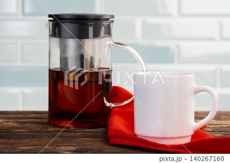 Tea served on a wooden kitchen table Tea served on a wooden kitchen table 140267160