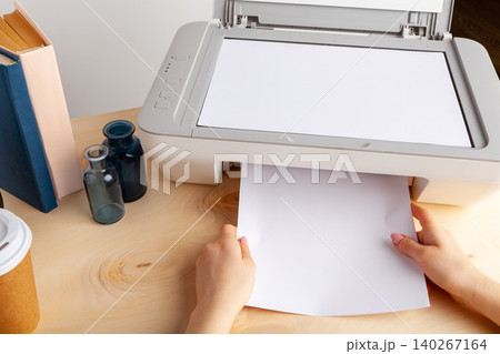 Close up of woman using a printer machine 140267164