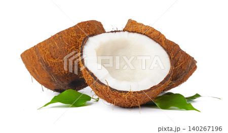 Cracked coconut with leaves isolated on white background Cracked coconut with leaves isolated on white background 140267196