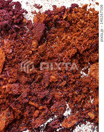 Bright colors of ground spices spread across a white surface in an organized manner 140267506