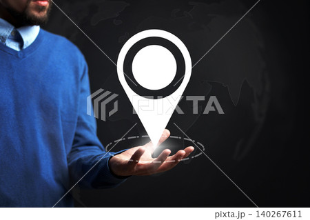 Travel map showing taxi route with location marker in hand during planning session Travel map showing taxi route with location marker in hand during planning session 140267611