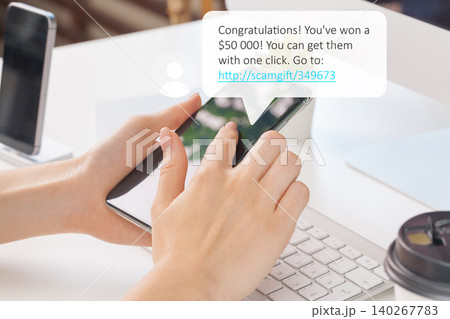 Scam call text message about winning money sent to a mobile phone 140267783