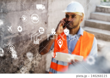 Logistics worker uses technology on site while coordinating transportation and delivery tasks Logistics worker uses technology on site while coordinating transportation and delivery tasks 140268115