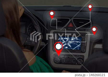 Taxi driver uses map app to navigate city and find locations for passenger drop-off Taxi driver uses map app to navigate city and find locations for passenger drop-off 140268121