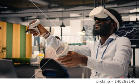 Black professional using VR glasses in corporate office environment. High-tech virtual reality applications display charts and performance metrics, combining metaverse simulation and data analysis. Black professional using VR glasses in corporate office environment. High-tech virtual reality applications display charts and performance metrics, combining metaverse simulation and data analysis. 140268140