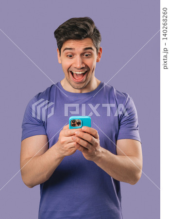 Surprised Man Looking at Smartphone Screen After Receiving News, social media 140268260
