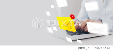 Sending messages while checking email notifications on a laptop Sending messages while checking email notifications on a laptop 140268358