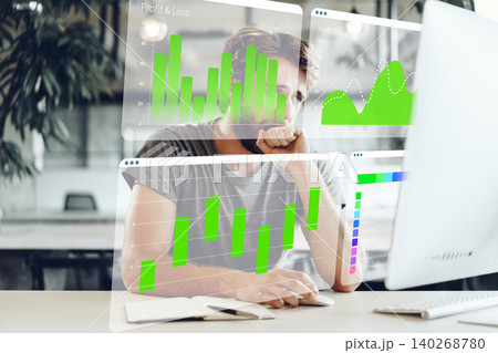 Business professional analyzing digital charts and data on computer screen in workspace Business professional analyzing digital charts and data on computer screen in workspace 140268780