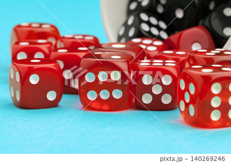 Gaming dices on blue background. Game concept. Gaming dices on blue background. Game concept. 140269246