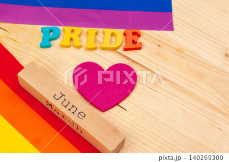 Gay pride flag on wooden table. creative photo. Gay pride flag on wooden table. creative photo. 140269300