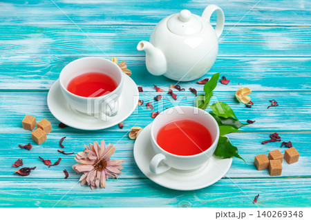 healthy herbal tea over blue background. creative photo. 140269348