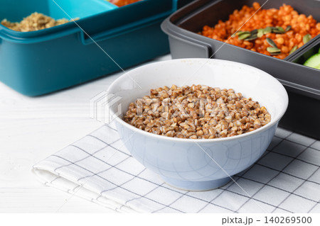 Lunch box with cooked buckwheat and fresh vegetable salad Lunch box with cooked buckwheat and fresh vegetable salad 140269500