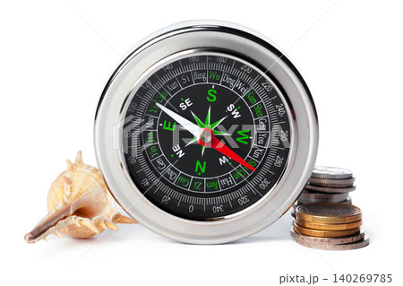 sea shells and old compass with sand isolated on white background. creative photo. 140269785