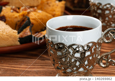 Two cups of coffee with traditional turkish desserts Two cups of coffee with traditional turkish desserts 140269862