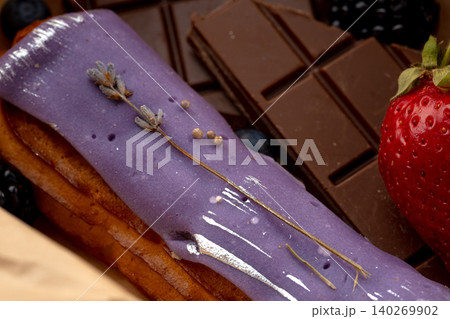 Eclair cake with lavender glaze close up Eclair cake with lavender glaze close up 140269902