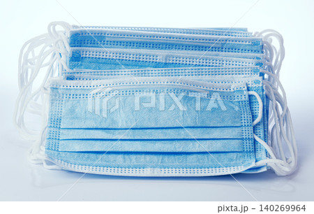 Stack of medical masks on white background Stack of medical masks on white background 140269964