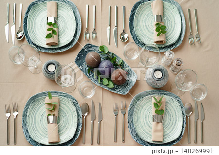 Luxury green table setting decorated with candles 140269991