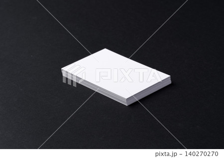White blank business cards on dark black background 140270270