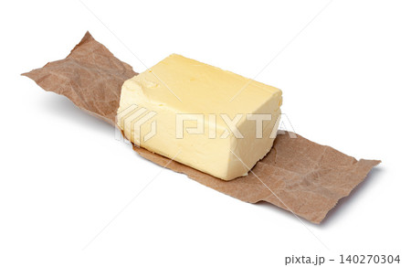 Fresh butter on craft paper isolated on white background 140270304