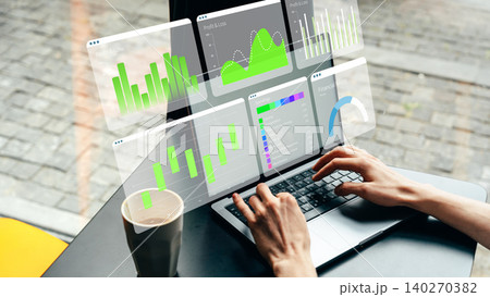 Business chart shows data on laptop screen with coffee in the background Business chart shows data on laptop screen with coffee in the background 140270382