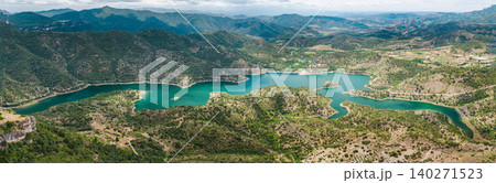 Aerial panorama of Siurana Reservoir surrounded by rugged mountains and rolling hills in Catalonia, Spain. T 140271523