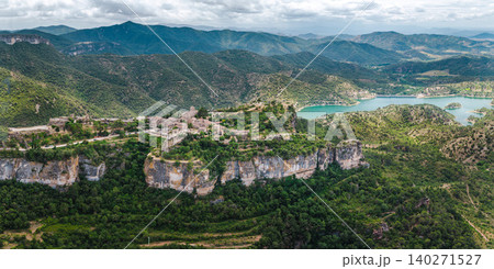 Aerial panoramic view of Siurana village perched on dramatic cliffs above Siurana Reservoir in Catalonia, Spain Aerial panoramic view of Siurana village perched on dramatic cliffs above Siurana Reservoir in Catalonia, Spain 140271527