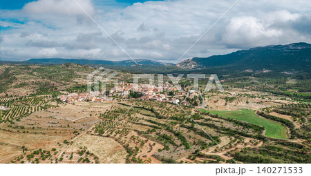 Aerial view of Cornudella de Montsant village surrounded by olive groves, vineyards and rural landscape in Priorat region of Catalonia Spain 140271533