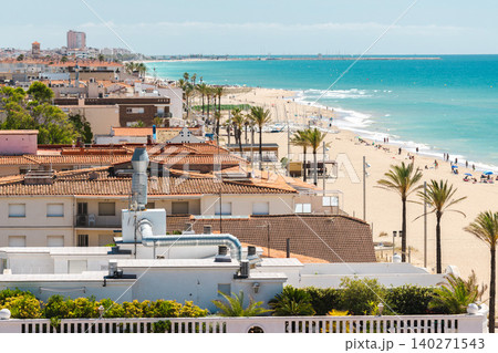 Panoramic view of Sant Salvador beach and Mediterranean coastline with palm trees, sandy shore. 140271543