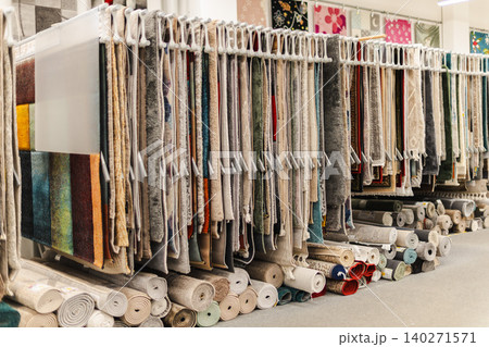 Large selection of carpets and rug samples displayed in home improvement store showroom Large selection of carpets and rug samples displayed in home improvement store showroom 140271571