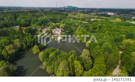 Aerial panorama of historic castle surrounded by lake and forest park near Essen in Germany Aerial panorama of historic castle surrounded by lake and forest park near Essen in Germany 140271591