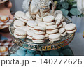 Elegant macarons stack on a decorative glass stand 140272626