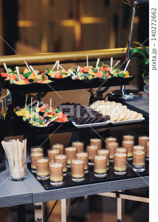 Elegant appetizers shine under warm, soft lighting Elegant appetizers shine under warm, soft lighting 140272662