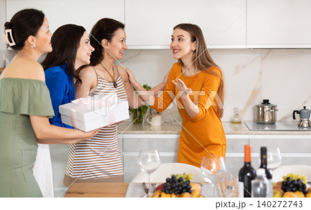 Cheerful girlfriends are happy to see each other at bachelorette party or party Cheerful girlfriends are happy to see each other at bachelorette party or party 140272743