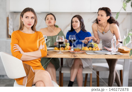 Group of women quarreling with young woman Group of women quarreling with young woman 140272878