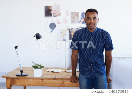 Man, portrait and desk at creative studio or startup as .graphic designer with photographs, project planning or magazine. Male person, face and confidence or small business, entrepreneur or workspace Man, portrait and desk at creative studio or startup as .graphic designer with photographs, project planning or magazine. Male person, face and confidence or small business, entrepreneur or workspace 140273915