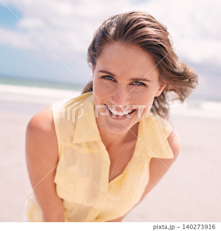 Happy woman, portrait and beach for summer holiday, weekend or tropical vacation in nature. Face of young female person with smile and yellow dress for fun travel or enjoying outdoor day by the ocean 140273916