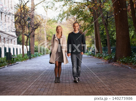 Happy, holding hands and portrait of couple in park for bonding, relationship and love outdoors. Interracial, dating and man with woman walking for fashion, care and weekend to relax together Happy, holding hands and portrait of couple in park for bonding, relationship and love outdoors. Interracial, dating and man with woman walking for fashion, care and weekend to relax together 140273986