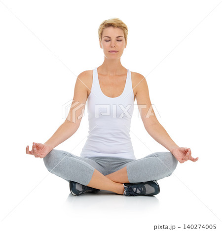 Woman, lotus pose with yoga and meditation in studio with mindfulness and peace of mind on white background. Exercise, wellness and health with chakra balance for holistic healing, spiritual and zen 140274005