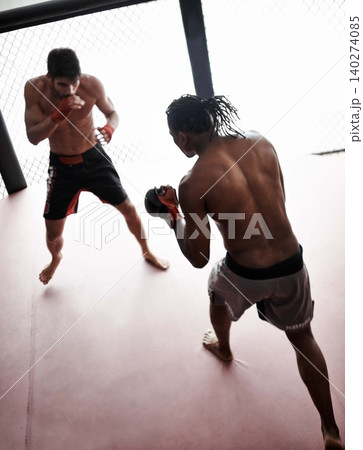 Boxing, men and gloves in ring with exercise to train for fight, fitness and competition with practice for match. Mma, male and fighter with determination, workout and kickboxing sport for challenge 140274085