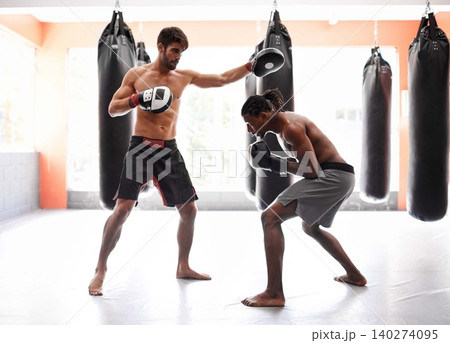 Men, boxing and competition with punch for fight practice for endurance challenge, champion or winner. Male people, gloves and cardio fitness with strength for battle professional, athlete or sport Men, boxing and competition with punch for fight practice for endurance challenge, champion or winner. Male people, gloves and cardio fitness with strength for battle professional, athlete or sport 140274095