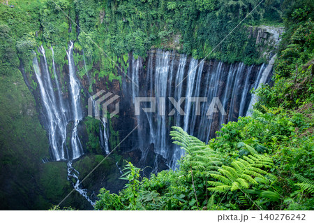 Tumpak Sewu waterfall is one of the most stunning waterfalls in Indonesia, standing at 120 meters tall with the most insane panorama view. Tumpak Sewu waterfall is one of the most stunning waterfalls in Indonesia, standing at 120 meters tall with the most insane panorama view. 140276242