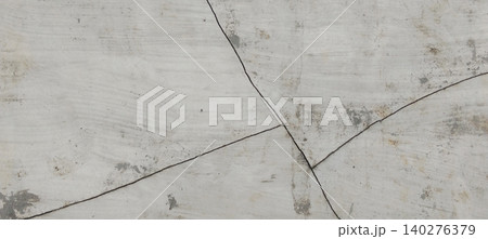 The background texture of a cracked concrete wall with a weathered surface 140276379