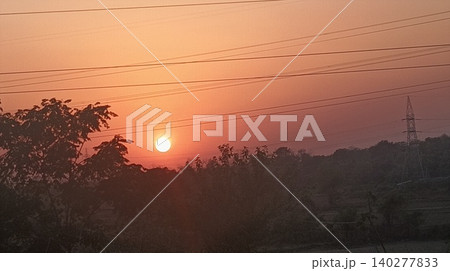 sunset at the mountain with the silhouette of a tree sunset at the mountain with the silhouette of a tree 140277833
