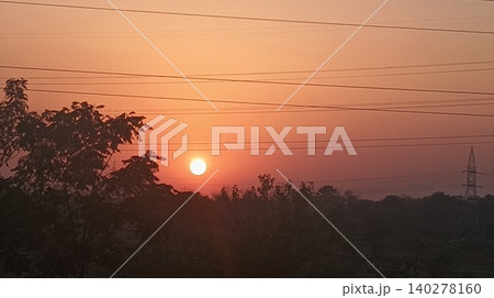 sunset behind the hill 140278160