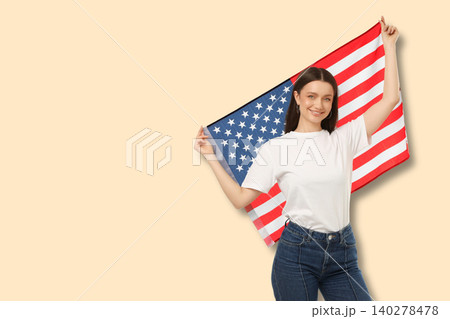 Young woman waves American flag with joy Young woman waves American flag with joy 140278478